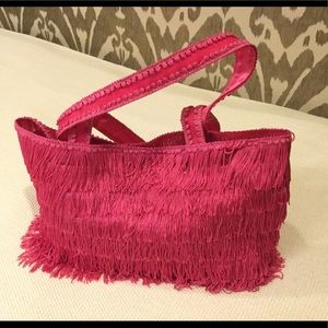 Hot pink fringe tote bag.
